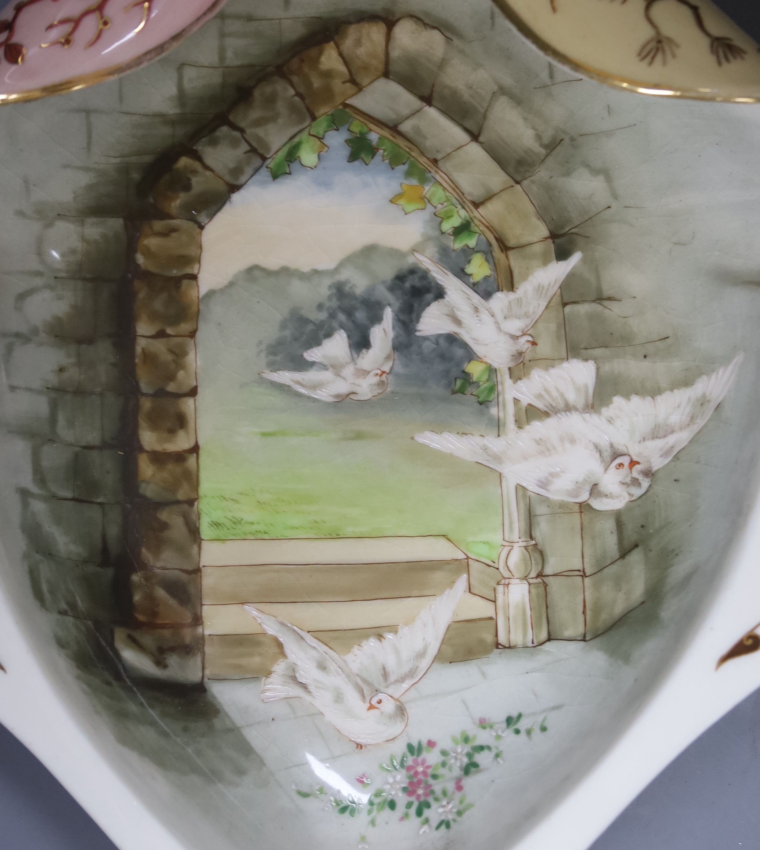 A pair of Victorian earthenware dessert dishes, decorated with birds and flowers, length 35cm